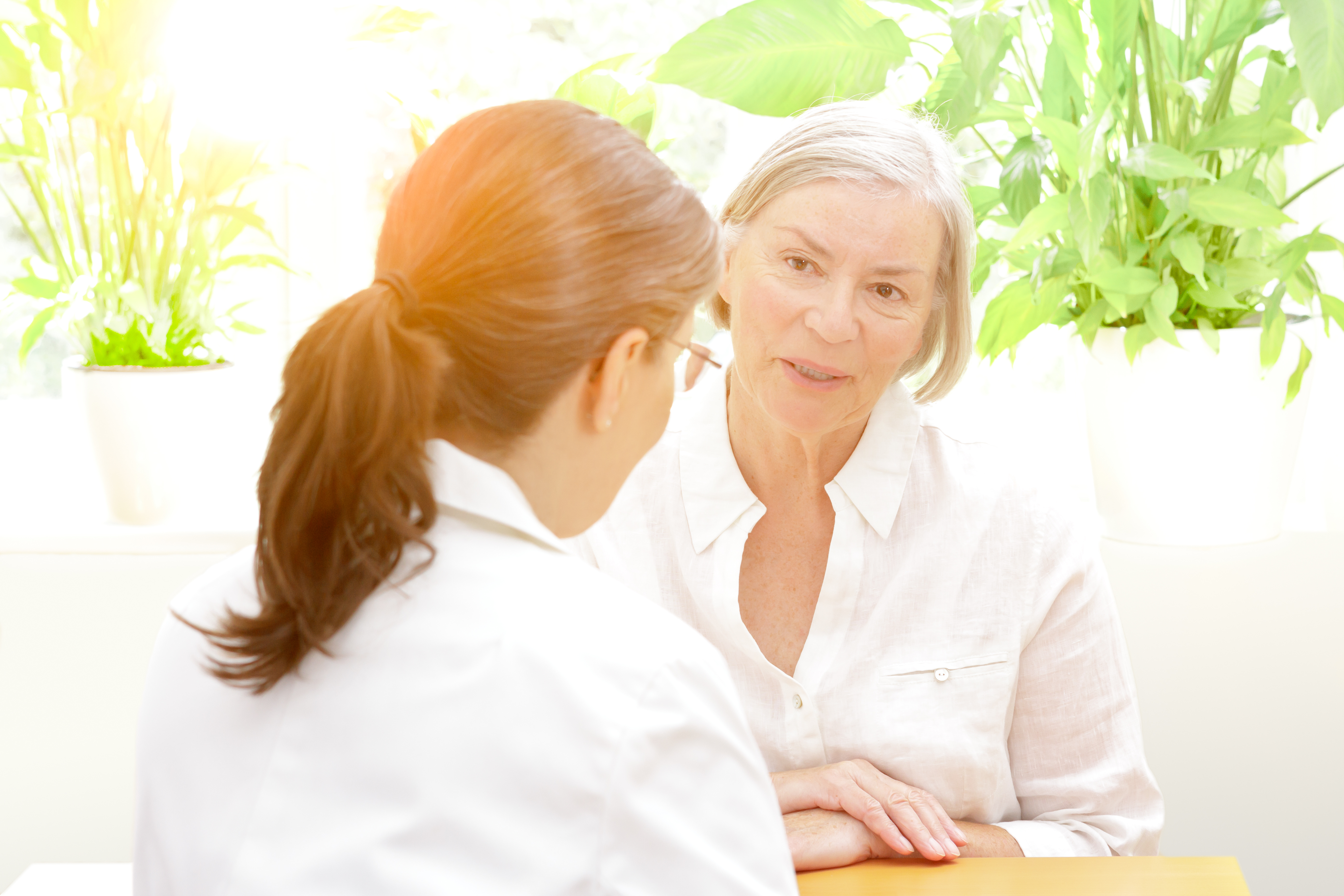 older patient talking with healthcare professional